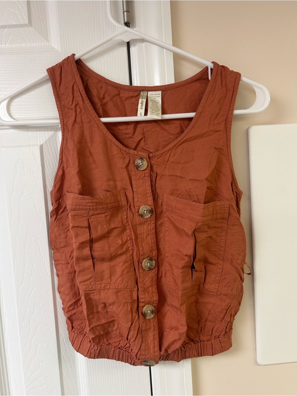 Japna rust-orange sleeveless button-front top